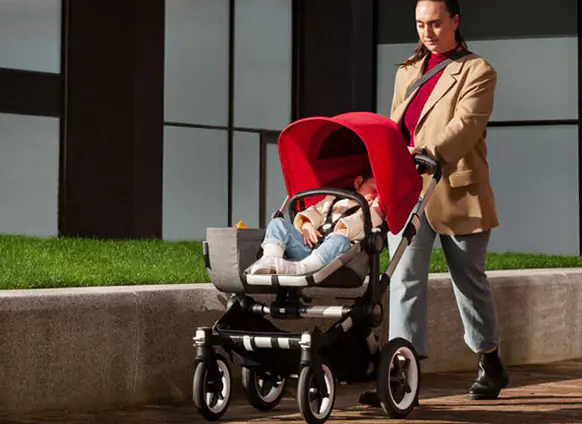 Bugaboo Donkey 3 Mono Complete, Mom walking with a baby on the stroller, TJs the Kiddies Store