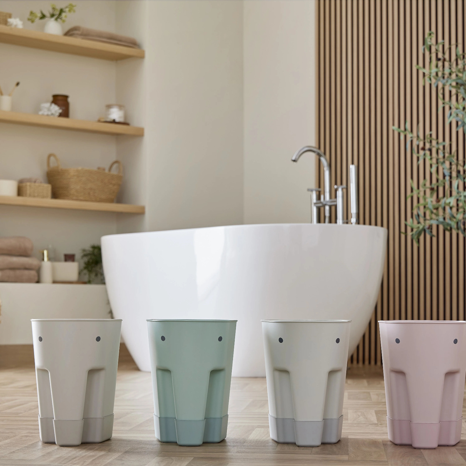 Bath toy caddy beside a family bath