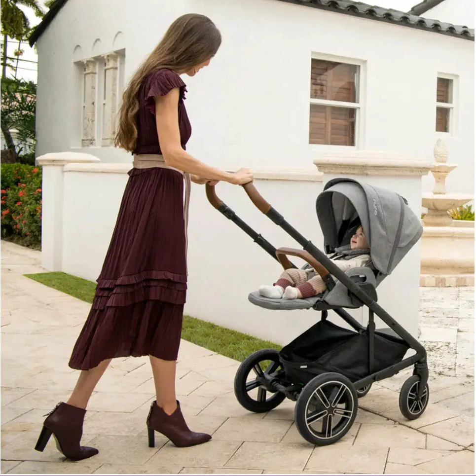 Parent walking with a baby in a stroller